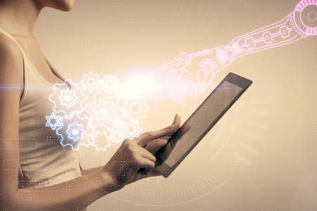 Double exposure of technology sketch hologram and woman holding and using a mobile device.の写真素材