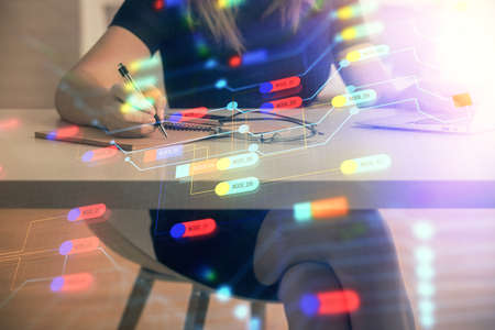 Multi exposure of woman hands working on computer and data theme hologram drawing. Tech concept.
