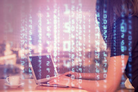 Multi exposure of woman hands working on computer and data theme hologram drawing. Tech concept.
