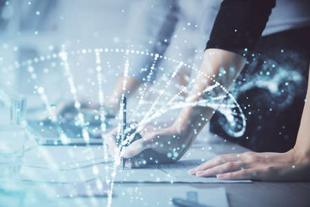 Double exposure of woman hands typing on computer and DNA hologram drawing. Medical education...
