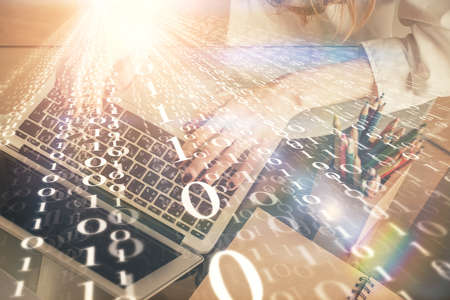 Double exposure of woman hands working on computer and data theme hologram drawing. Tech concept.