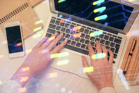 Double exposure of woman hands working on computer and data theme hologram drawing. Top View....
