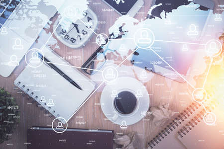 Double exposure of social network theme drawing over table with phone. Top view. People connecting...