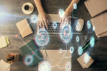 Double exposure of woman hands working on computer and data theme hologram drawing. Top View....