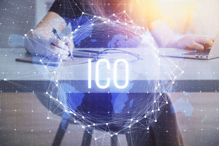 Double exposure of woman hands typing on computer and crypto market theme hologram drawing....