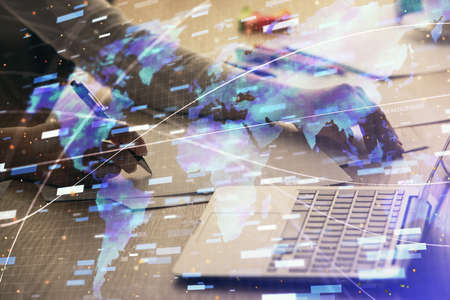 Multi exposure of woman hands working on computer and data theme hologram drawing. Tech concept.の写真素材