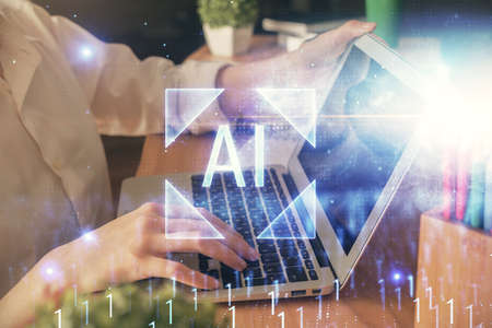 Double exposure of woman hands working on computer and data theme hologram drawing. Tech concept.