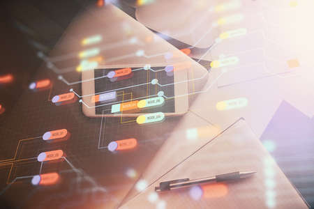 Double exposure of technology theme drawing over work table desktop. Top view. Global data analysis...
