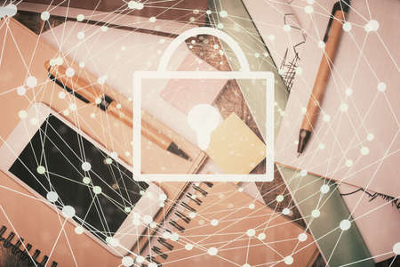 Double exposure of lock drawing over desktop. Top view. Security concept.