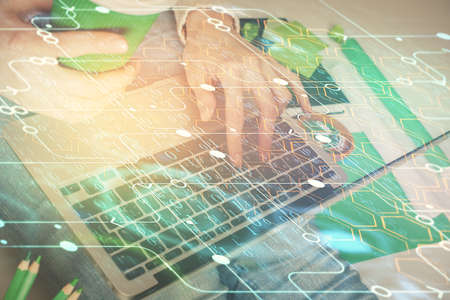 Double exposure of woman hands working on computer and data theme hologram drawing. Tech concept.