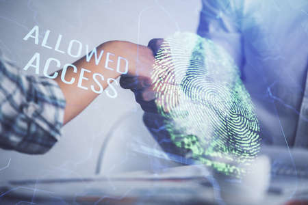 Double exposure of fingerprint hologram and handshake of two men. Security concept.の写真素材