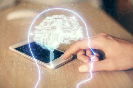 Double exposure of brain sketch hologram and woman holding and using a mobile device.