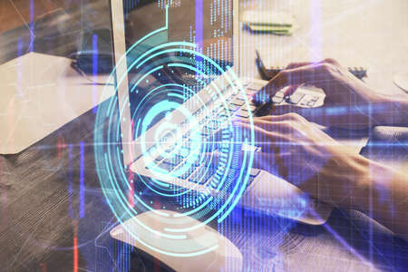 Double exposure of woman hands working on computer and data theme hologram drawing. Tech concept.