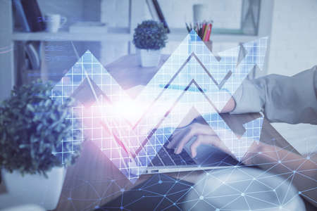 Double exposure of woman hands typing on computer and arrows drawing. Success concept.