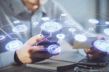 Double exposure of man's hands holding and using a phone and social network theme drawing.の写真素材