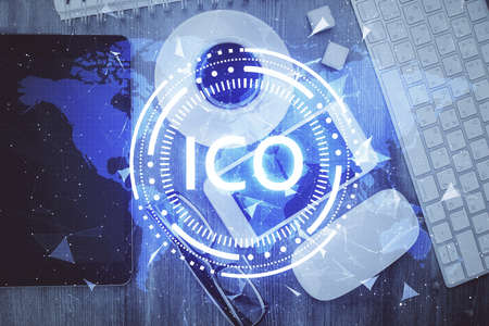Double exposure of blockchain theme hologram over table with phone. Top view. Crypto technology...