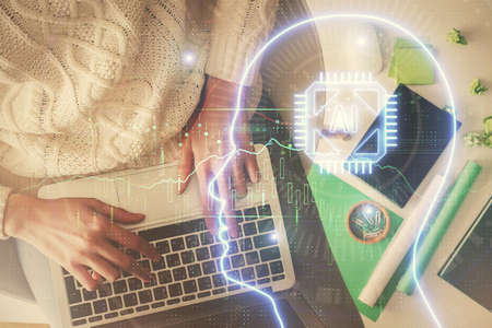 Double exposure of woman working on computer andhuman brain hologram drawing. Top View. Ai concept.の写真素材