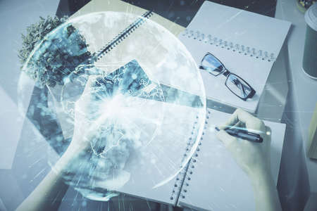 Multi exposure of woman on-line shopping holding a credit card and financial theme drawing. Business E-commerce concept.の写真素材