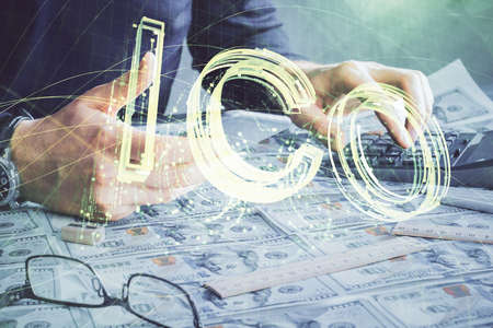 Double exposure of man's hands holding and using a phone and crypto currency blockchain theme...