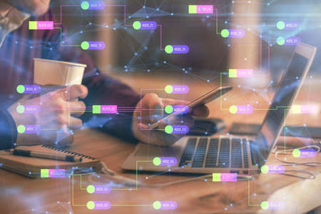 Multi exposure of man's hands holding and using a digital device and data theme drawing. Innovation...