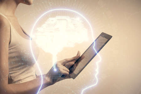 Double exposure of brain sketch hologram and woman holding and using a mobile device.