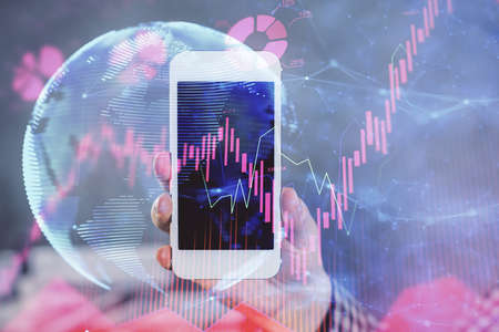 Double exposure of man's hands holding and using a phone and international business theme drawing.
