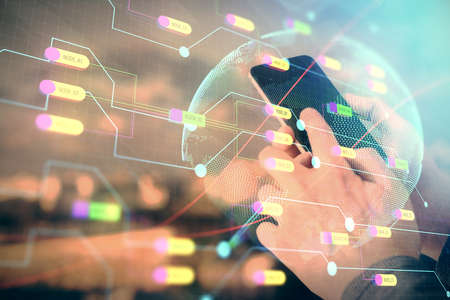 Multi exposure of man's hands holding and using a digital device and map drawing. International...