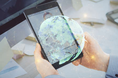 Double exposure of man's hands holding and using a phone and social network theme drawing.の写真素材