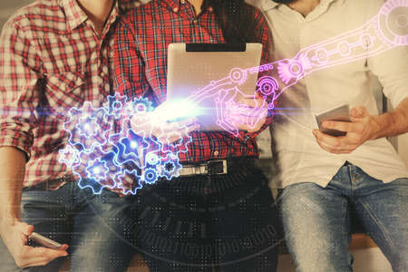 Double exposure of data theme hologram drawing and man and woman working together holding and using a mobile device.の写真素材