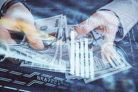 Multi exposure of Tech drawing hologram and USA dollars bills and man hands. Technology concept.
