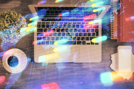 Multi exposure of data theme drawing hologram over topview work desk background with computer. Concept of technology.の写真素材