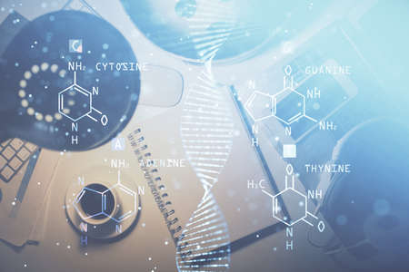 Double exposure of dna theme drawing and work table top veiw. Concept of education.の写真素材