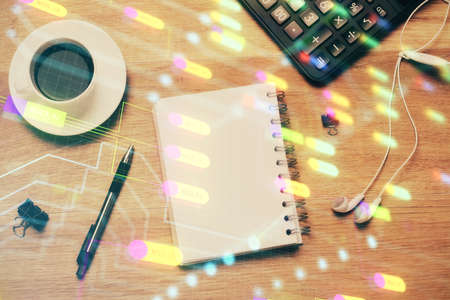 Double exposure of map hologram drawing over desktop. Top view. International connection concept.の写真素材