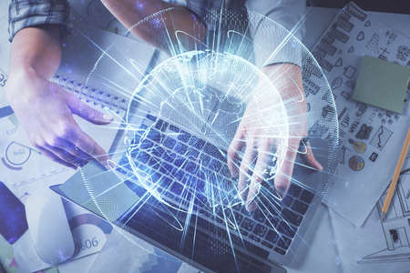 Double exposure of man and woman working together and business theme hologram drawing. Computer...