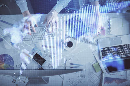 Double exposure of man and woman working together and business theme hologram drawing. Computer...