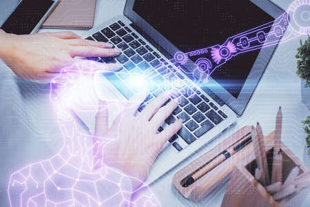 Double exposure of woman hands typing on computer and man in AR glasses drawing. Education concept.の写真素材