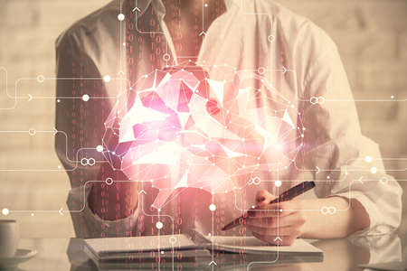 Double exposure of brain sketch hologram and woman holding and using a mobile device.