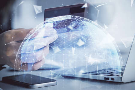 Multi exposure of woman on-line shopping holding a credit card and financial theme drawing. Business E-commerce concept.の写真素材