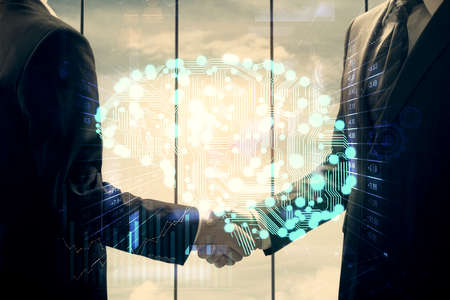 Double exposure of brain hologram and handshake of two men. Partnership in IT industry concept.