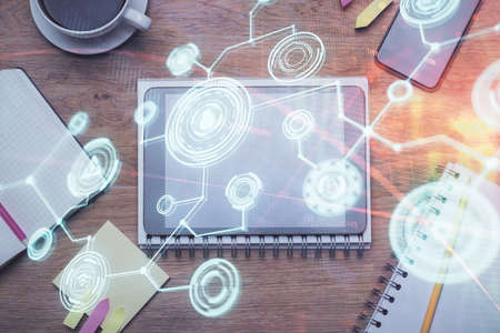 Double exposure of social network theme drawing over table with phone. Top view. People connecting concept.の写真素材