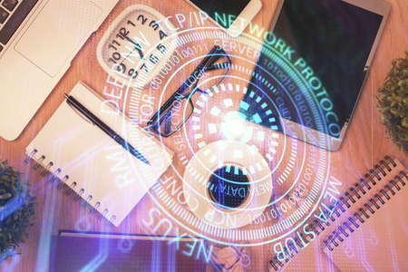 Double exposure of technology theme drawing over work table desktop. Top view. Global data analysis concept.の写真素材