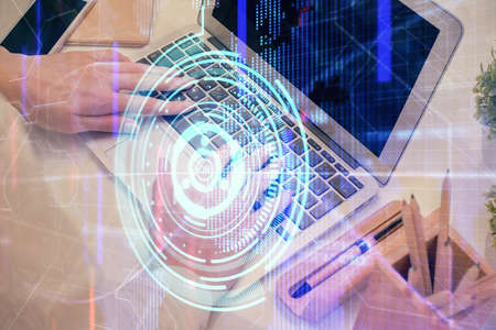 Double exposure of woman hands working on computer and data theme hologram drawing. Tech concept.