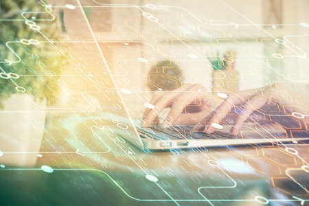 Double exposure of woman hands working on computer and data theme hologram drawing. Tech concept.