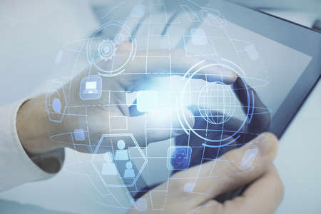 Double exposure of man's hands holding and using a phone and social network theme drawing.
