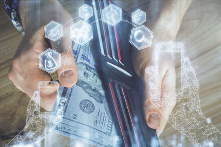 Multi exposure of Tech drawing hologram and USA dollars bills and man hands. Technology concept.
