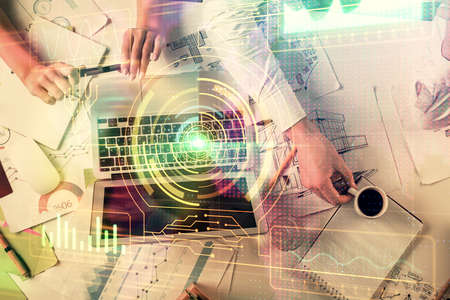 Double exposure of man and woman working together and technology theme drawing hologram. Big data...