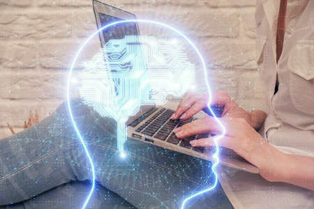 Multi exposure of woman hands working on computer and brain hologram drawing. Ai concept.