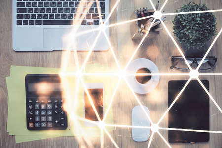 Double exposure of social network theme drawing over table with phone. Top view. People connecting concept.の写真素材
