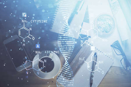 Double exposure of dna theme drawing and work table top veiw. Concept of education.