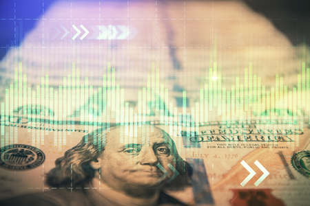Double exposure of forex graph drawing over us dollars bill background. Concept of financial...